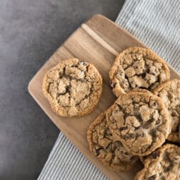 Warm, freshly baked chocolate chip cookies with a golden-brown exterior and gooey, melty chocolate chunks—perfect for any sweet tooth.